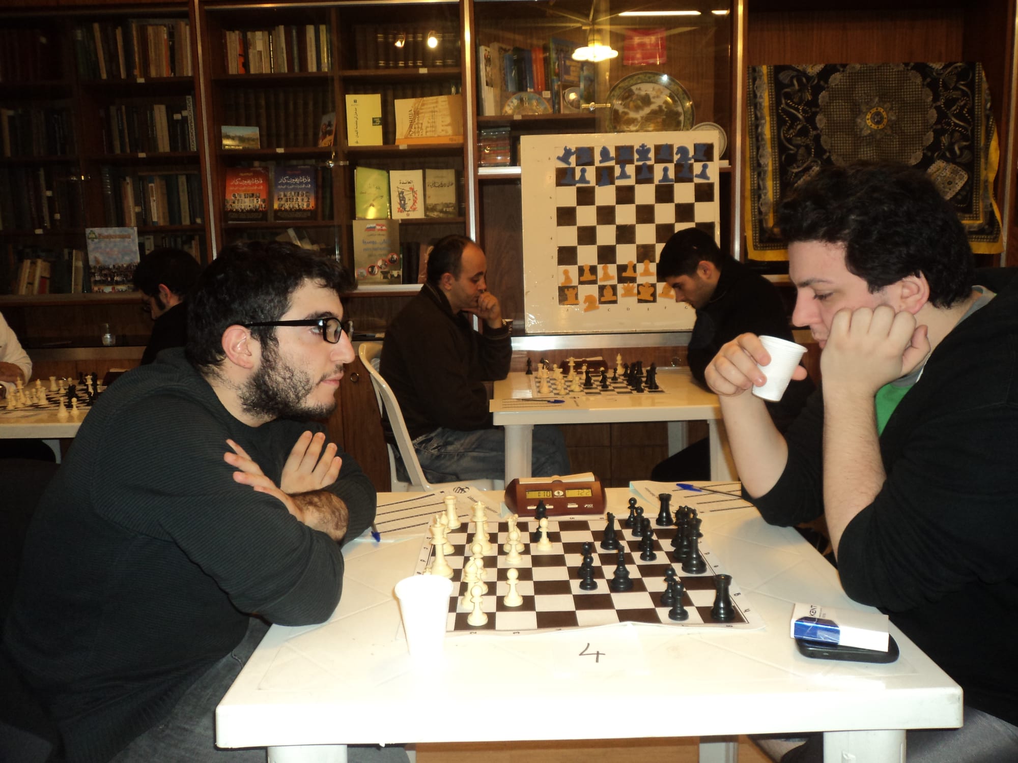 A coffee break mid-game at the club boards