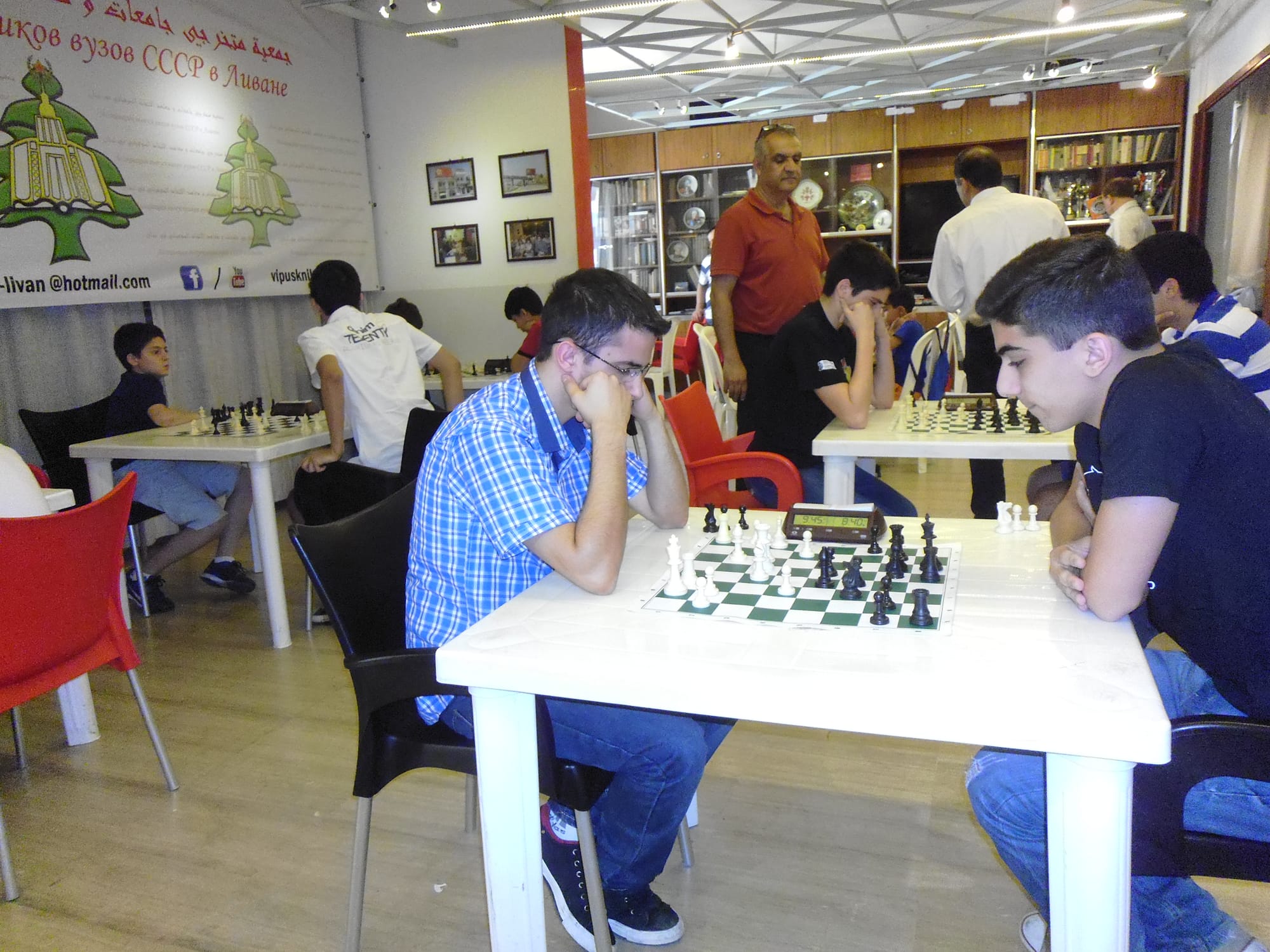 Players of all ages think through their games in the club room