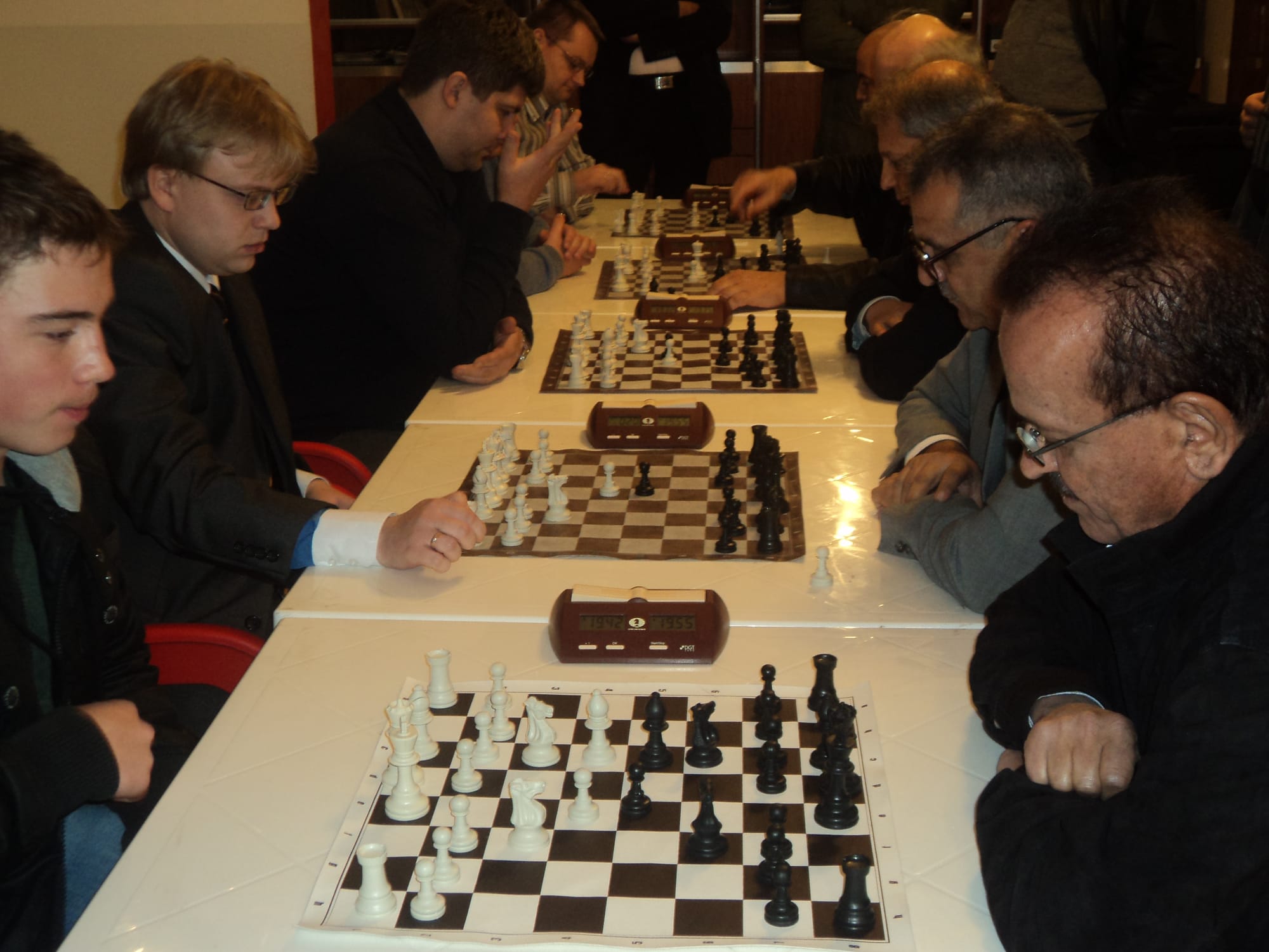 Rows of boards and clocks during a team match
