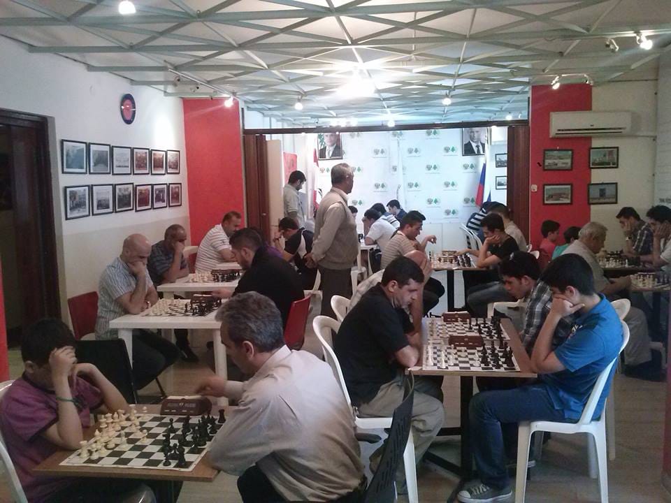Full club hall in play during a tournament round