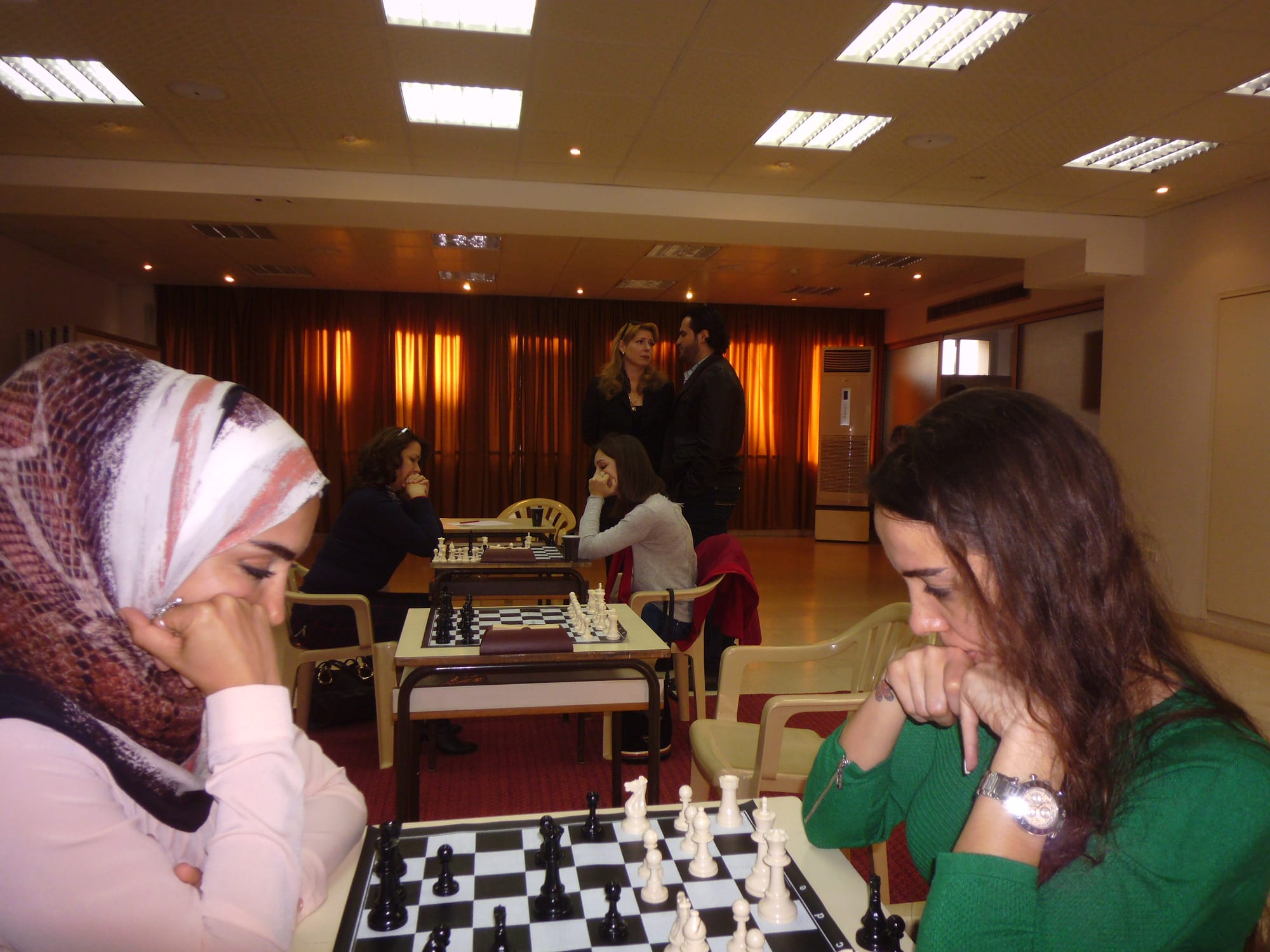 Women players concentrate during a tournament round