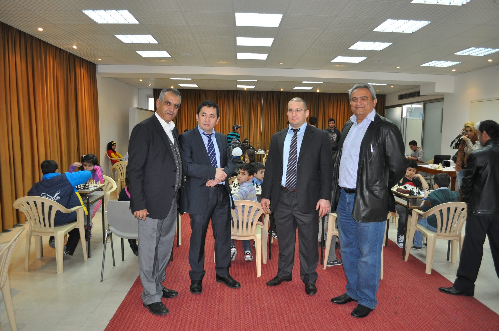 Guests and organisers pose in the tournament hall